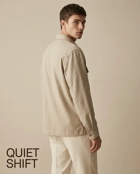Premium Zara fashion editorial. Main Subject: Young male model wearing a warm oa - AI生成图片 2