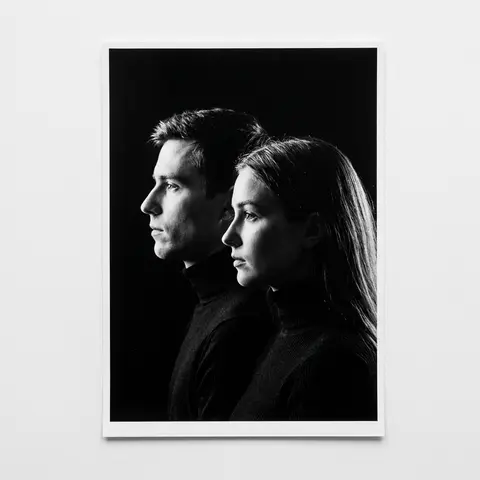 A minimalist black and white cinematic portrait featuring two individuals (male - AI生成图片 1