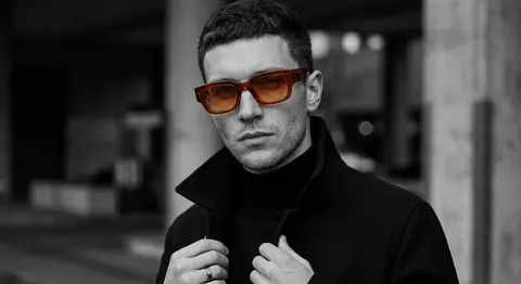A photorealistic luxury editorial close-up portrait of Orion Vale, a fictional f - AI生成图片 2