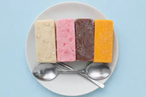 A quartet of rectangular kulfi slices, featuring distinct flavors of cashew-stud - AI生成图片 2