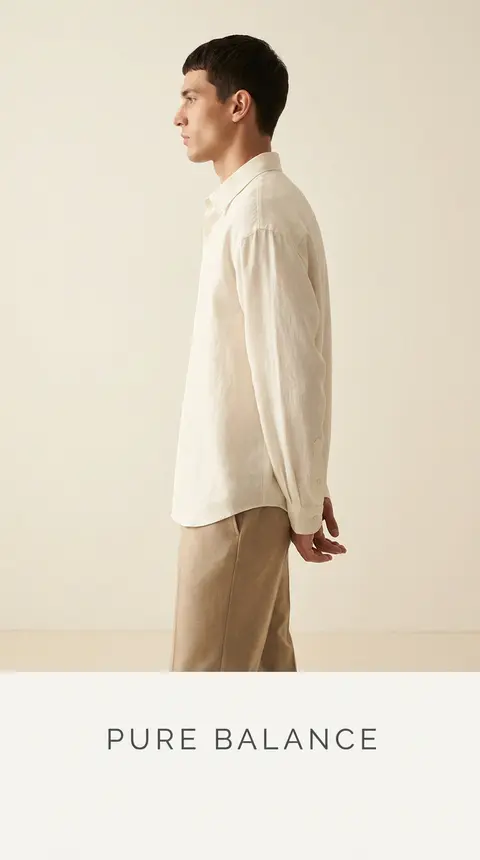 Premium minimalist fashion campaign. Main Subject: Male model wearing an oversiz - AI生成图片 1
