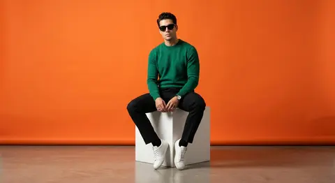 A stylish fashion muse named Adrian Vale sits atop a crisp white cube in a minim - AI生成图片 4