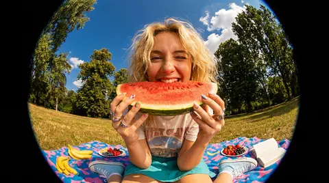 A close-up, ultra-wide-angle fisheye lens photograph of a cheerful young woman w - AI生成图片 1