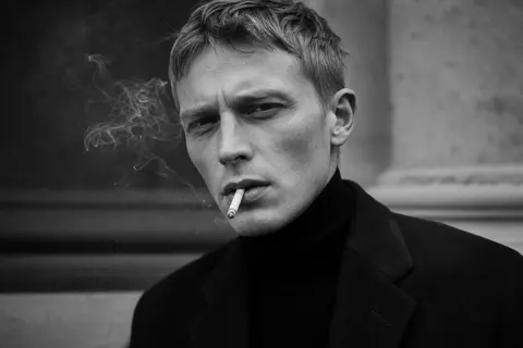 Ultra-realistic fashion black and white portrait of a man with short light hair, - AI生成图片 3