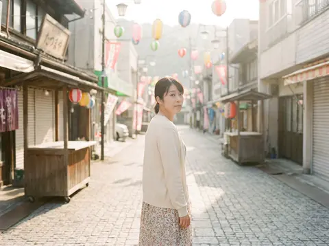 A beautiful Japanese woman walking through an empty festival street the morning - AI生成图片 4