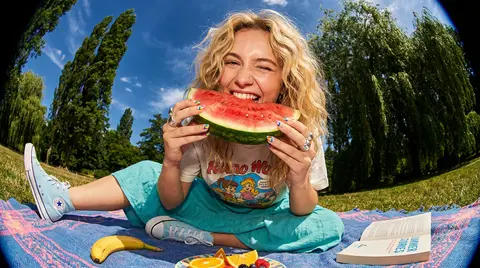 A close-up, ultra-wide-angle fisheye lens photograph of a cheerful young woman w - AI生成图片 2