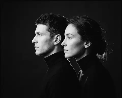 Ultra-minimal fine art editorial portrait in monochrome: a man and a woman align - AI生成图片 2